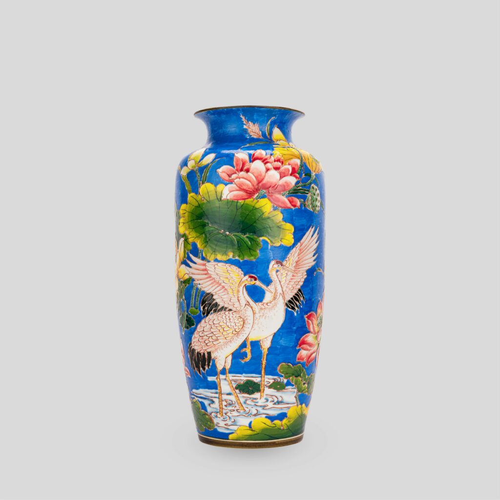 Ceramic Vase with a bird on it.